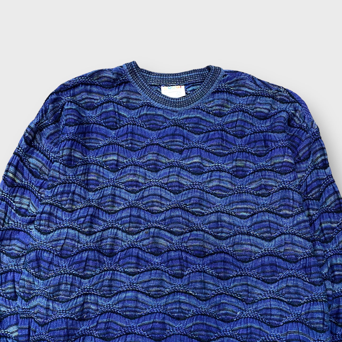 "COOGI" Border pattern 3D knit sweater