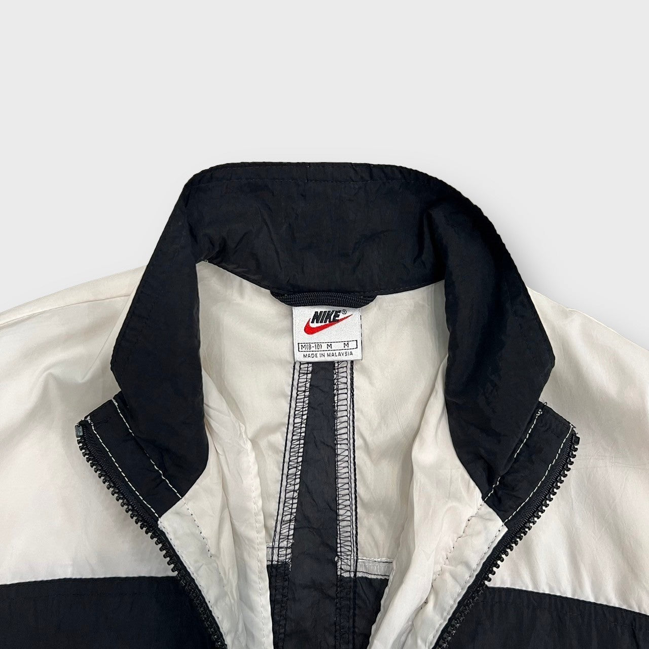 00's "NIKE"
Zip up nylon track jacket