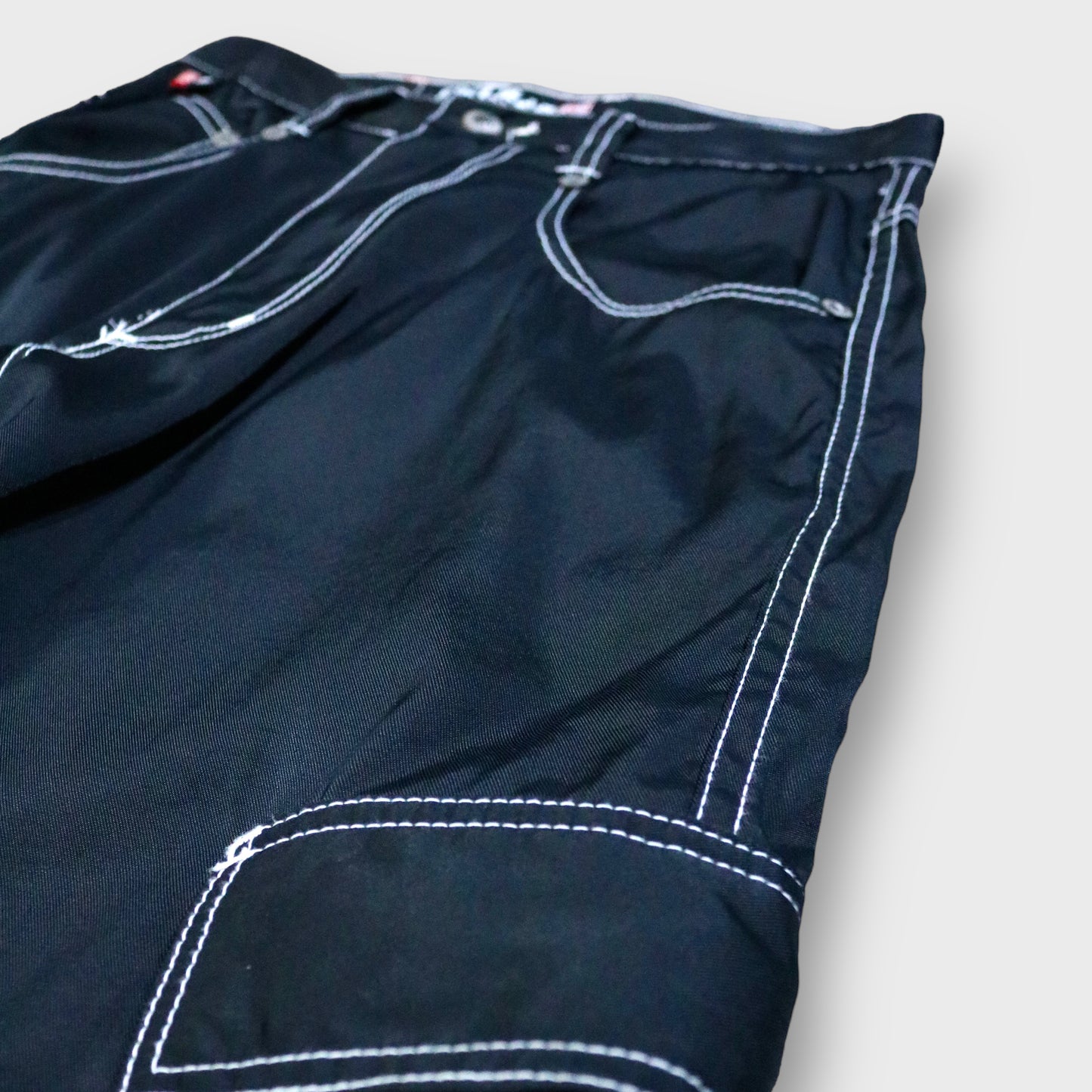 "KIKWEAR" Nylon gimmick flare pants